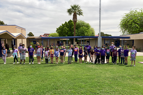 Students wearing purple outside school